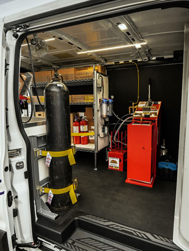 Mobile service van interior with fire extinguishers and other miscellaneous equipment