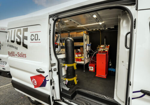 Mobile service van interior with fire extinguishers and other miscellaneous equipment